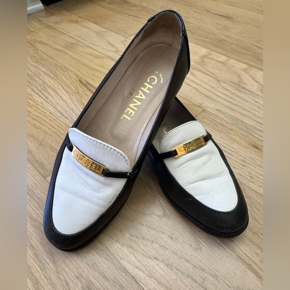 CHANEL Two-Tone Black and White Loafers with Gold Accent